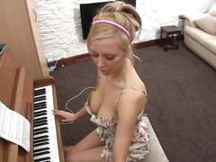 Downblouse playing piano