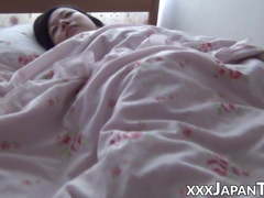 Japanese beauty relaxes while her pussy is explored
